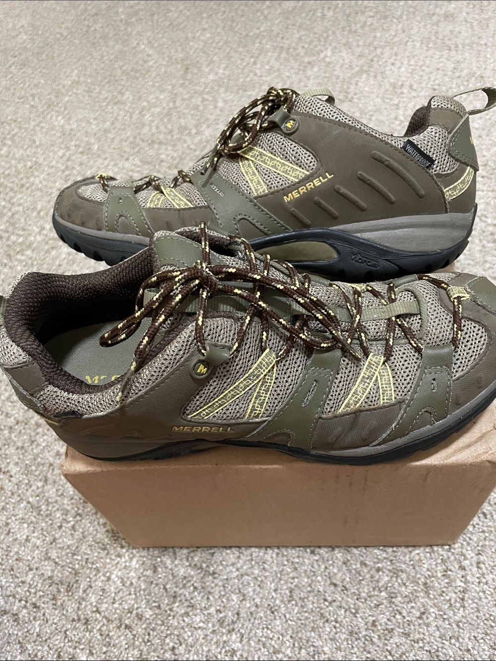 Merrell Olive colored, waterproof hiking shoes. Women’s size 9. Like new.